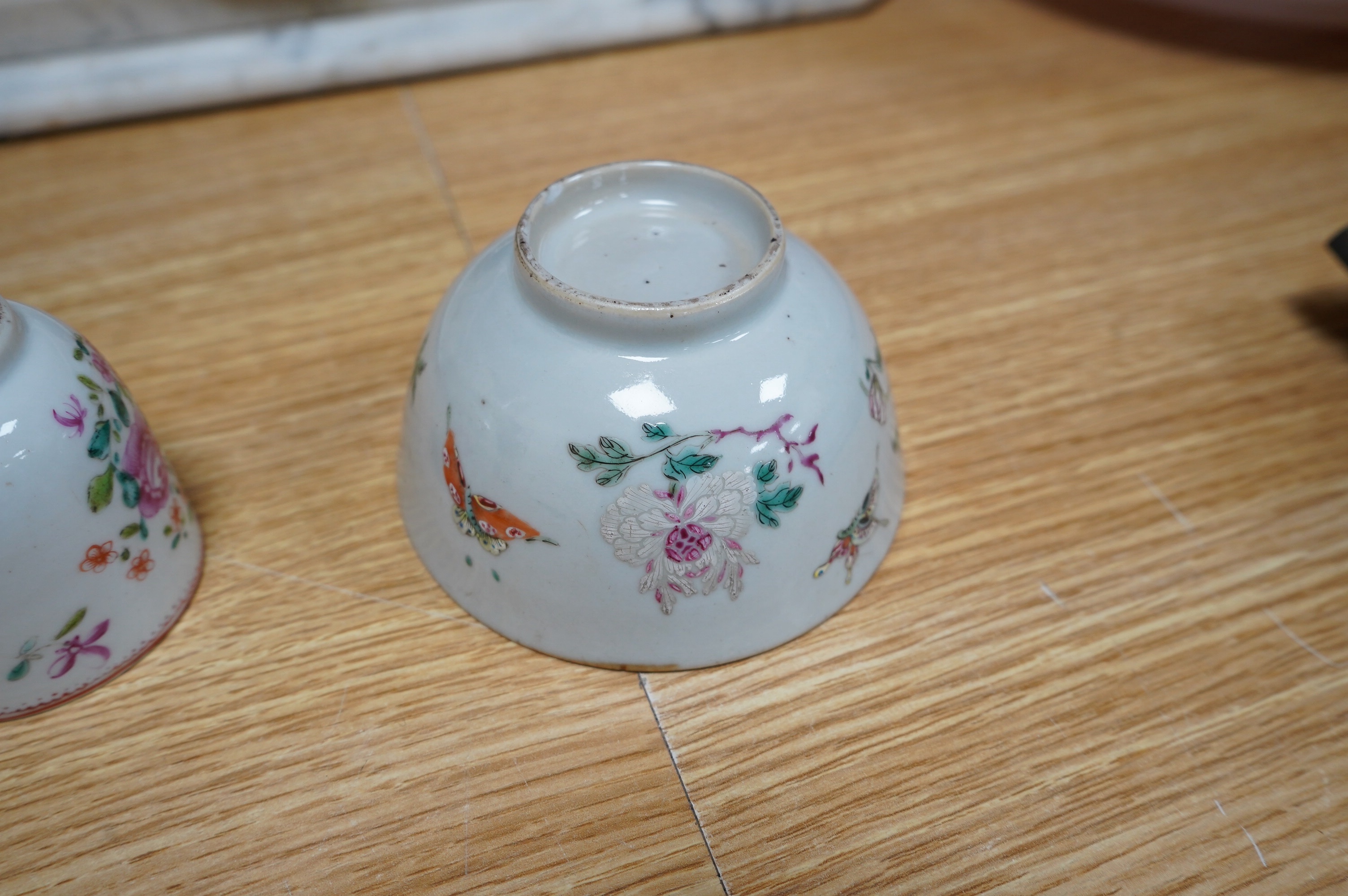 Three small 18th century Chinese export porcelain dishes, three bowls and a cup, largest 14cm. Condition - poor